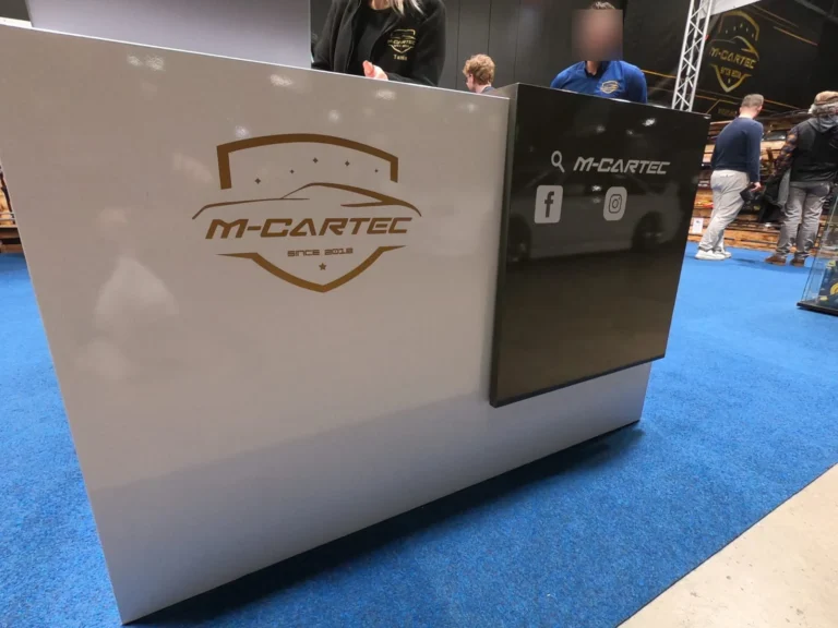 Comptoir du stand M-Cartec &mdash; International Motor Show Luxembourg 2025